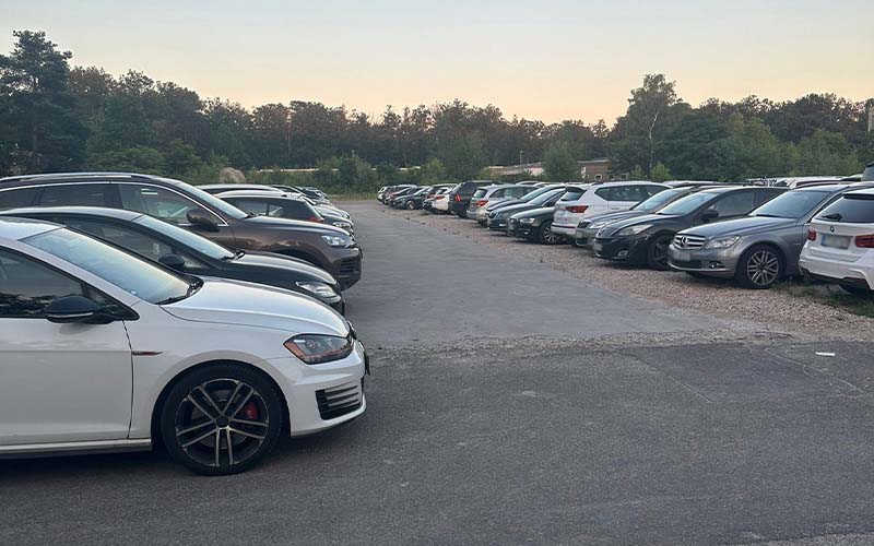 a group of cars parked in a parking lot