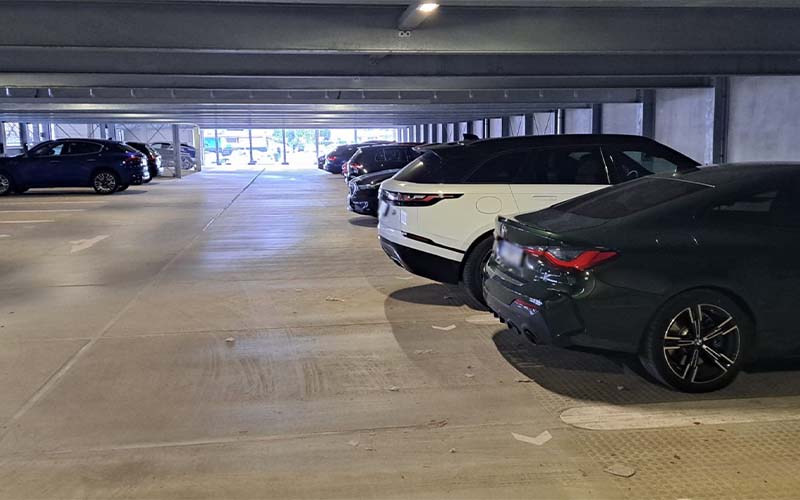 a parking garage with cars parked