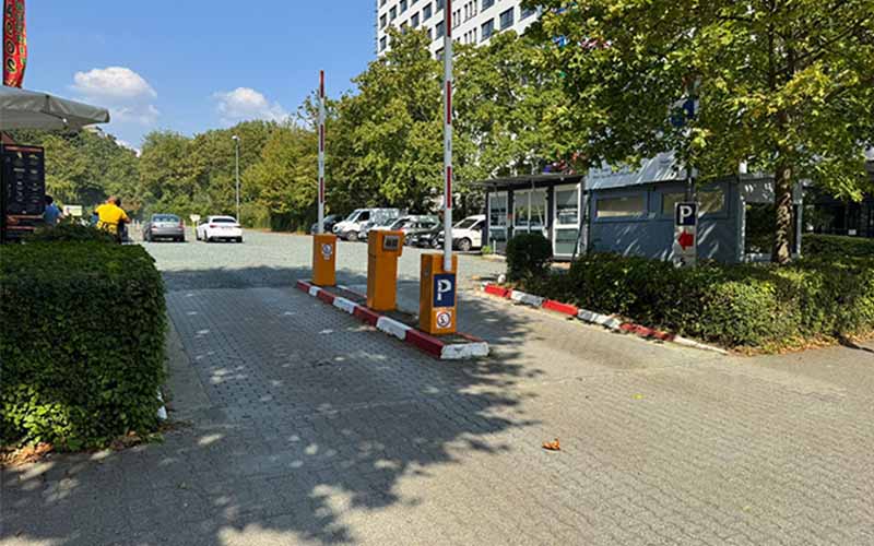 a parking lot with a parking meter and a parking lot