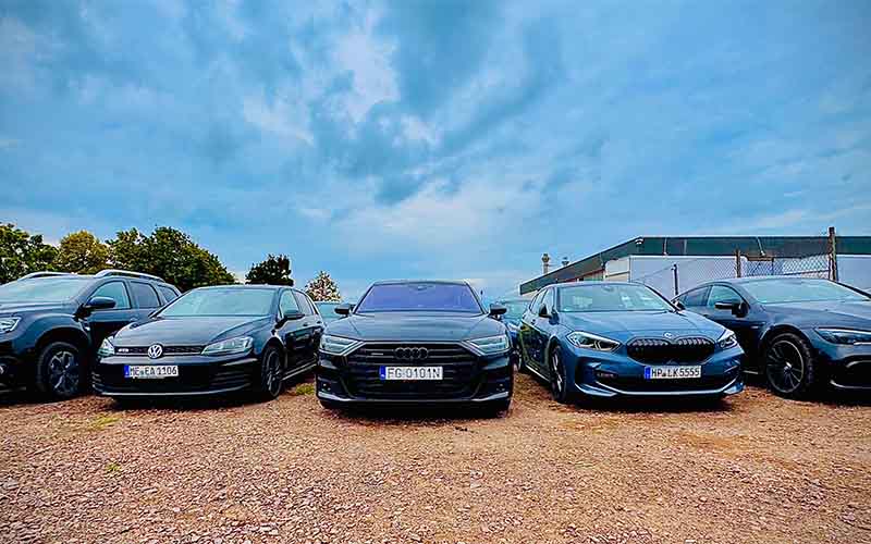 a group of cars parked in a lot