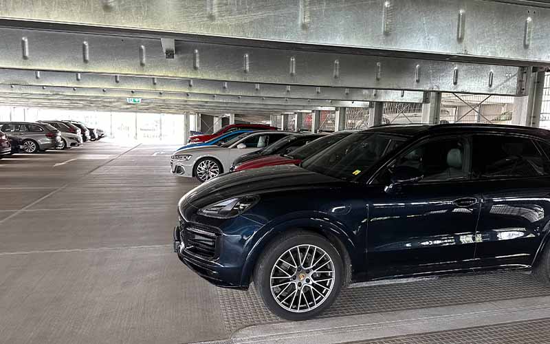 a group of cars parked in a parking garage