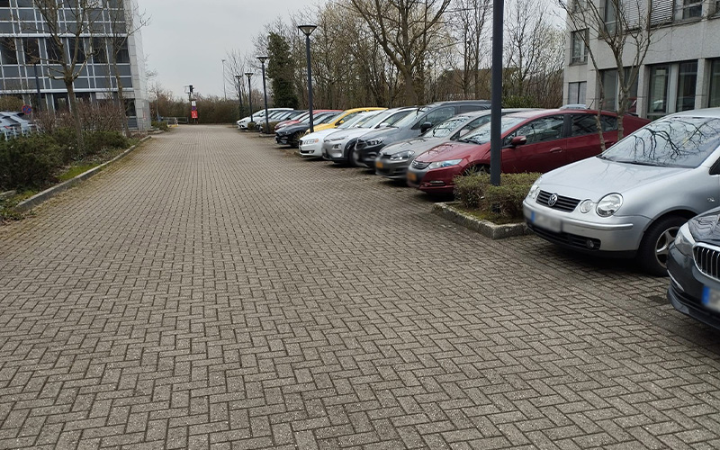 a row of cars parked in a parking lot
